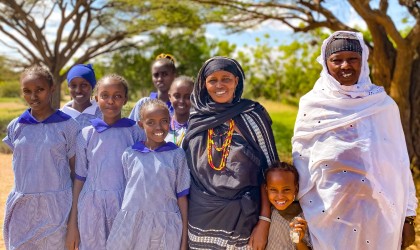 Doke Konchora and Gumato Ibrae from Chalbi Salt Self Help Group, pictured with school girls they support to stay in education. Photo: Jennifer Nolan