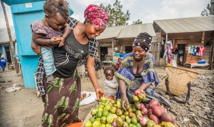 Justine received training and support from Concern to start selling her home-grown fruit in Kitchanga, which helps her provide for her family. Photo: Pamela Tulizo/Panos/Concern Worldwide