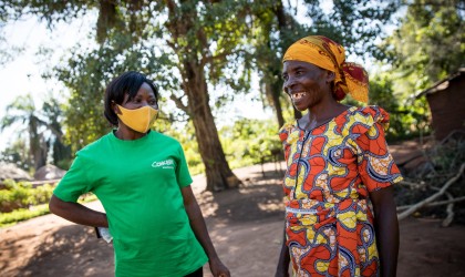 Adrenise Lusa speaks with Micheline Kayiba, programme manager of Concern Worldwide’s graduation programme in the village of Kaiha, Manono Territory. Photo: Hugh Kinsella 