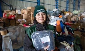 Ozge Celebi of Concern Worldwide Türkiye says the team organising distribution of donated goods have been finding messages of goodwill for the recipients of Adiyaman city centre who were badly hit by the earthquake of February 6th, 2023. As many as half of the buildings were destroyed or rendered uninhabitable. (Photo: Kieran McConville/Concern Worldwide)