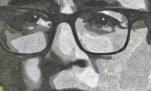 A close up of Andy Burnham's face drawn in greyscale on a field
