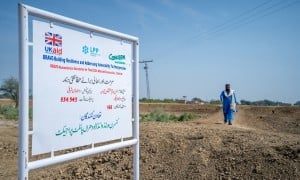 A UK Aid logo and a Concern Worldwide logo on a sign in Pakistan
