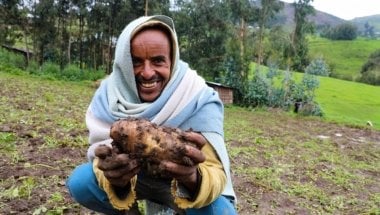 Concern-supported farmer Ahimed Ali Mahamed happily shows off potato crop produce, Ethiopia Photo: Jennifer Nolan