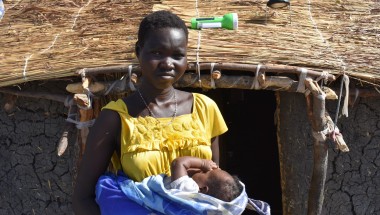 Nyaphan holding her now two-month-old baby Nyaguande