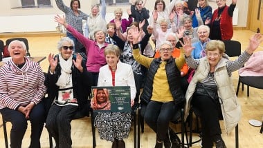 Nellie holding a Concern plaque, along with other Concern volunteers. Photo: Concern Worldwide.