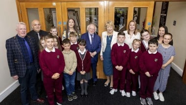 Pupils and teachers from Bunscoil Mhic Reachtain with Irish President Michael D Higgins and Sabina Higgins and Concern&#039;s Amelia Deehan