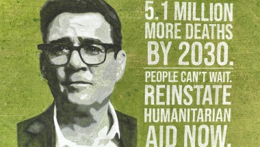 Andy Burnham's face drawn in paint on a field next to text warning of 5.1 million deaths by 2030