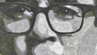 A close up of Andy Burnham's face drawn in greyscale on a field