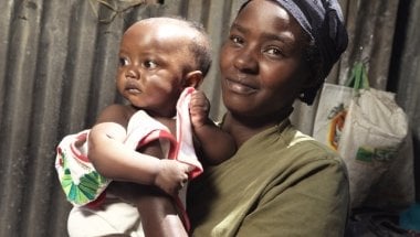 Florence Mutungi (32) with six-month-old Precious - one of her twin daughters. Florence and her husband are bringing up their five children in their one room house in one of Nairobi’s largest slums, Mukuru where chronic malnutrition and stunting is a majo