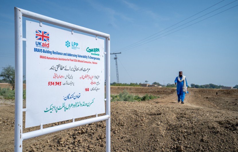A UK Aid logo and a Concern Worldwide logo on a sign in Pakistan
