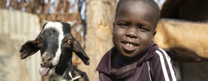 Chiny, four, and Simone, the family goat, in Gambella, Ethiopia. Photo: Kieran McConville/Concern Worldwide