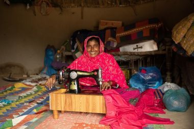 Suheend with her sewing machine in Pakistan. Photo: Khaula Jamil / Concern Worldwide