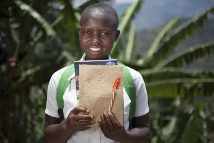 Amida, 14, smiling all the way to school in Burundi with her new schoolbooks and pens. Photo: Abbie Trayler-Smith / Concern Worldwide Amida, 14, smiling all the way to school in Burundi with her new schoolbooks and pens. Photo: Abbie Trayler-Smith / Concern Worldwide