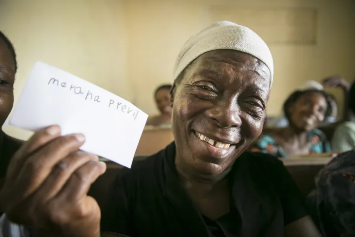 Merana Previl (63) literacy training course, part of the “Building Hope & Opportunities in Haiti” integrated urban program in Cité Soleil, Port au Prince. Merana has just learned to write her own name. A number of the women taking part have never before attended school. Photo: Kieran McConville/ Concern Worldwide Merana Previl (63) literacy training course, part of the “Building Hope & Opportunities in Haiti” integrated urban program in Cité Soleil, Port au Prince. Merana has just learned to write her own name. A number of the women taking part have never before attended school. Photo: Kieran McConville/ Concern Worldwide