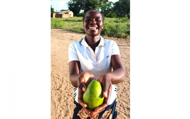 Malita Isaac, 25, shows off one of the avocados she’s grown in Malawi with the support of Concern. Photo: Jason Kennedy /Concern Worldwide Malita Isaac, 25, shows off one of the avocados she’s grown in Malawi with the support of Concern. Photo: Jason Kennedy /Concern Worldwide