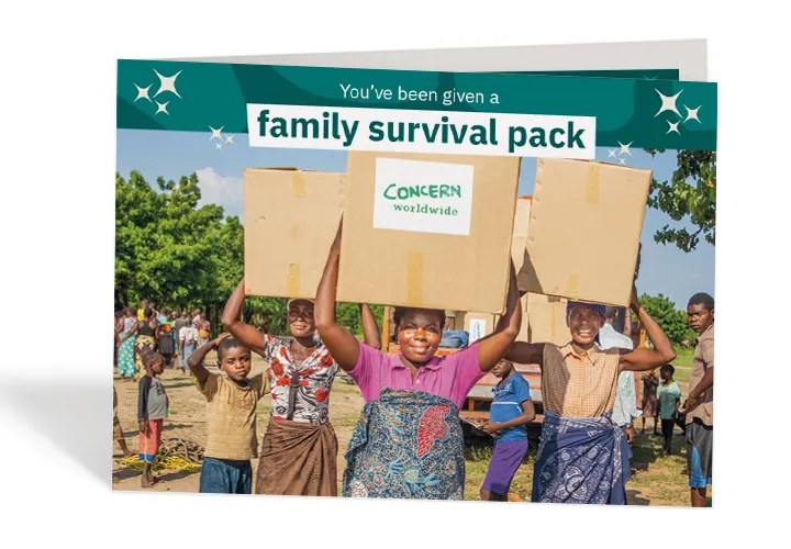 Mother-of-two Belita returning to her family in Malawi with the supplies they urgently needed after the devastation of Cyclone Idai. Photo: Gavin Douglas / Concern Worldwide Mother-of-two Belita returning to her family in Malawi with the supplies they urgently needed after the devastation of Cyclone Idai. Photo: Gavin Douglas / Concern Worldwide