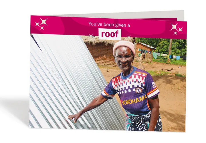 Dorcia, 71, with her brand-new waterproof roof sheets. Photo: Jason Kennedy / Concern Worldwide Dorcia, 71, with her brand-new waterproof roof sheets. Photo: Jason Kennedy / Concern Worldwide