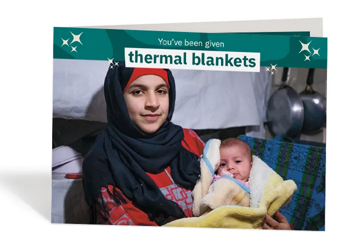 Wafdeh* was so glad that she could keep her baby warm. Photo: Gavin Douglas / Concern Worldwide Wafdeh* was so glad that she could keep her baby warm. Photo: Gavin Douglas / Concern Worldwide