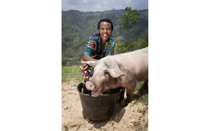 Violette Bukeyeneza (45) with the pig she has bought from the profits of her business at her home in Bukinanyana, Cibitoke, Burundi. She is a beneficiary of tthe Graduation programme and her business has gone from strength to strength. Photo: Abbie Trayler-Smith / Concern Worldwide Violette Bukeyeneza (45) with the pig she has bought from the profits of her business at her home in Bukinanyana, Cibitoke, Burundi. She is a beneficiary of tthe Graduation programme and her business has gone from strength to strength. Photo: Abbie Trayler-Smith / Concern Worldwide