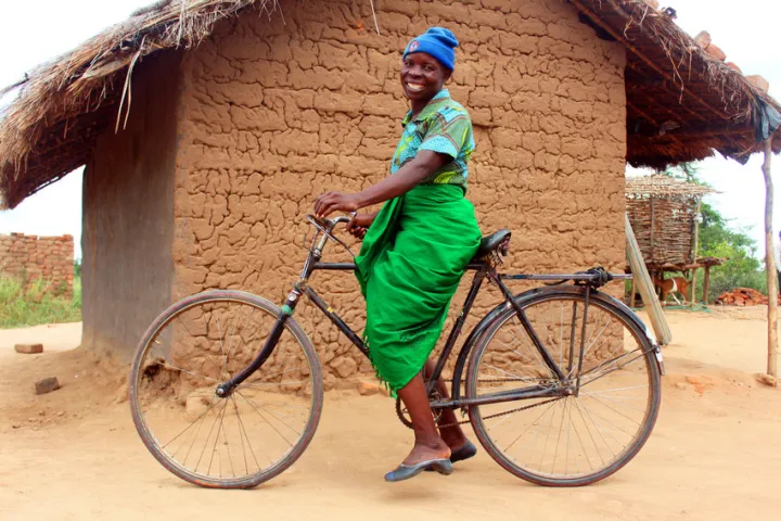 Jennifer gets ready to set off on her bike in Malawi. Photo: Jason Kennedy / Concern Worldwide