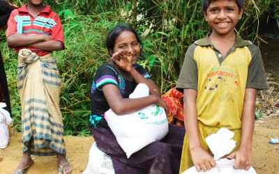 Yasir* and his siblings are very happy to receive the food relief provided by Concern Worldwide in Cox's Bazar, Bangladesh. Photo: Nusrat Amin/Concern Worldwide