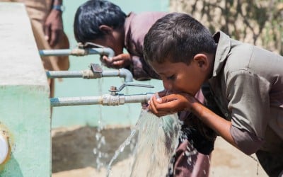 Children from Satla Bheel village enjoy drinking water from the water plant system installed by Concern. Pakistan. Photo: Black Box Sounds/Concern Worldwide