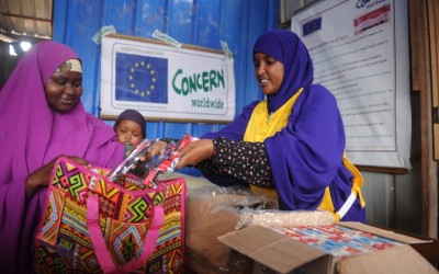 Naima, Concern Nurse dispensing Plumpy Nut to mother Hani at OTP Centre. Somalia. Photo: Mohamed Abdiwahab/Concern WW