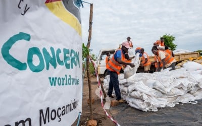 Workers unload supplies from a truck at a Concern distribution centre in Ndeja, Mozambique. Photo: Tommy Trenchard / Concern Worldwide
