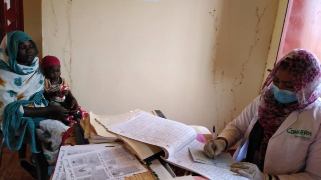 Concern nutrition staff observing basic protection while treating people. West Darfur, Sudan.