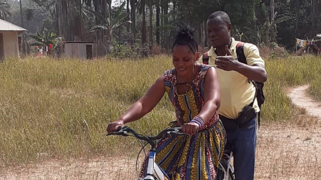 Influential Woman in Sierra Leone having a cycling lesson.