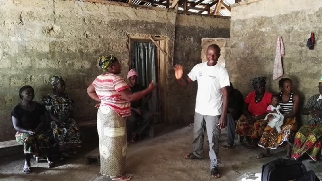 A couple acting out a role play as part of a gender transformational session with couples in Sierra Leone. Photo by Adèle Fox, December 2017