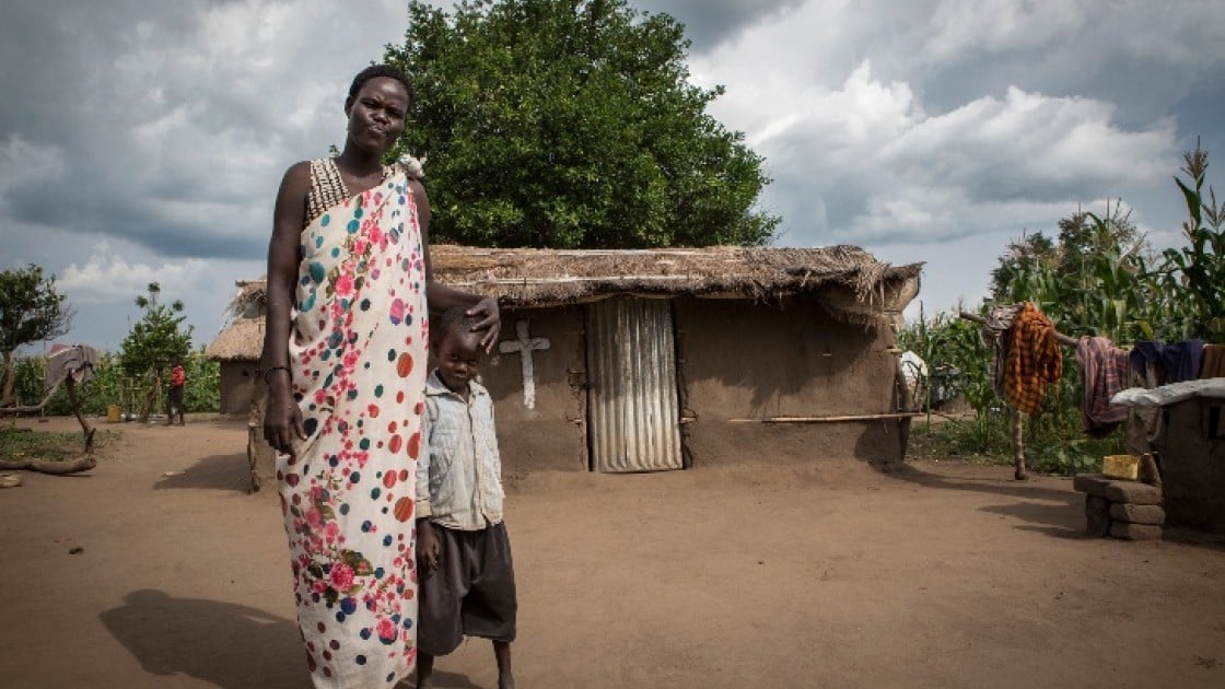 Ayen Duot, 40 years old, with her son Bul Athian in Adjumani, Uganda. Ayen and her children fled Blor, the capital of Jonglei State in South Sudan and now live in a refugee settlement in Uganda. Photo: Panos Pictures / Concern Worldwide.