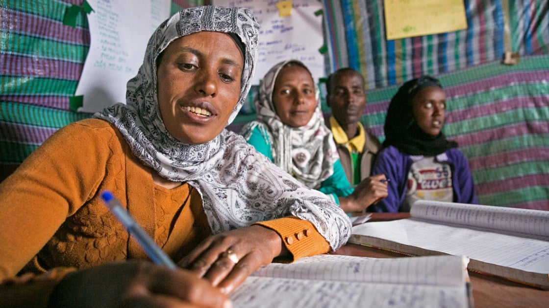 Tasam Haileselasie is the chairwoman of the Savings & Credit Co-Op in Megera in Northern Ethiopia. She tracks contributions and withdrawals of local micro-loans, which allow villagers to borrow three times their savings. Photo: Kieran McConville