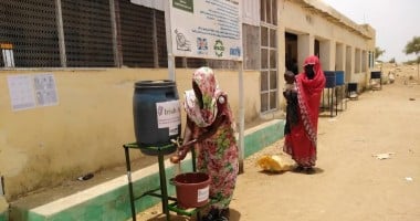 To help reduce the spread of Covid-19 beneficiaries wash hands before entering Concern supported Nutrition Facility in West Darfur.