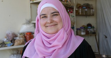 Bushra runs a small grocery shop near the tented settlement where she lives. Photo: Darren Vaughan