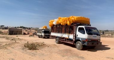 A truck carries aid supplies