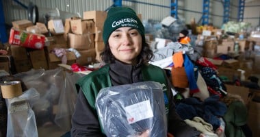 Ozge Celebi of Concern Worldwide Türkiye says the team organising distribution of donated goods have been finding messages of goodwill for the recipients of Adiyaman city centre who were badly hit by the earthquake of February 6th, 2023. As many as half of the buildings were destroyed or rendered uninhabitable. (Photo: Kieran McConville/Concern Worldwide)