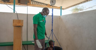 A child is weighed at the Concern health post in Baga Sola, Western Chad. Photo: Eugene Ikua/Concern Worldwide