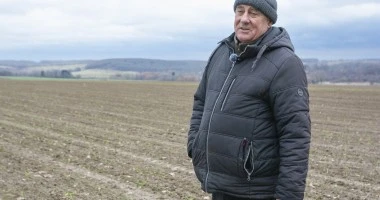 A photo of Ivan Ivan Zakharenko standing in a field.