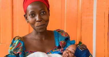 Esperance with her three week old daughter