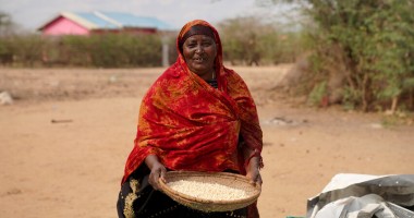 Ralia at her home with her harvested maize which she is currently putting in storage, Tana River, Kenya. Photo: Eugene Ikua/Concern Worldwide.
