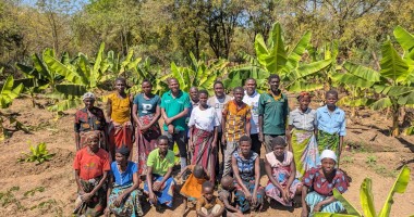 Concern Malawi Team standing with banana sucker recipients in Traditional Authority Ndamera in Nsanje District. Photo: Concern Worldwide.