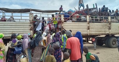 Families board the IOM truck for OTA Photo: CEN.