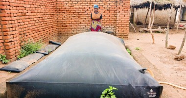 Ligness Mpoto of Mtali Village in the Kakuyu Watershed with her biodigester. Photo: Concern Worldwide.