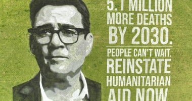 Andy Burnham's face drawn in paint on a field next to text warning of 5.1 million deaths by 2030