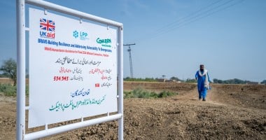 A UK Aid logo and a Concern Worldwide logo on a sign in Pakistan