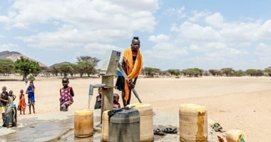 Children pump water at a tap in Kangalita., Kenya. The region has been severely affected by drought. Photo: Natalia Jidovanu/Concern Worldwide.