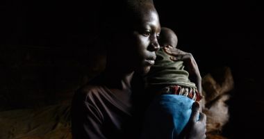 Aline Nsabimana is worried about her three-month-old son Roger – her only child, after a fever broke out and he began coughing during the night. Photo: Chris de Bode/Panos Pictures for Concern Worldwide