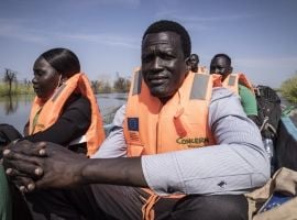 Gatkuoth Matai, Concern Disaster and Risk Reduction Officer, travels with colleagues to visit a community that was surrounded by flood water near Bentiu in Unity State, South Sudan. Photo: Ed Ram/Concern Worldwide
