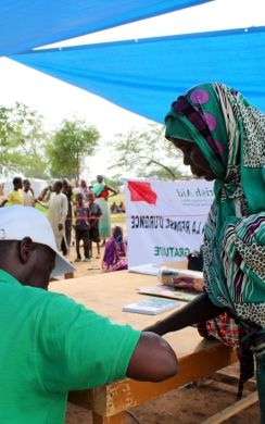 Concern staff meet with a local community.